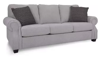 2279 - This traditional sofa set has a rolled arm with optional nail studs and semi-attached back.  Available as a sofa, loveseat, chair, ottoman and also comes a queen bed.  Made by Canadian upholstery artisans.