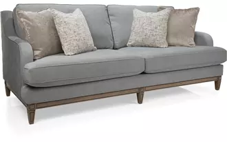 2508 - This sofa combines graceful curves with tailored detailing to create a timeless design. A gently sloped arm and deep seat cushions offer inviting comfort, while versatile styling allows you to choose between a refined show wood base or sleek flared legs.