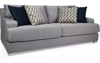 2702 - Sofa with its clean modern lines, extra-large pillows, low profile and wide arms is a designer’s dream.  Sink into its premium high-resiliency 2lb super soft foam core and feel the difference of quality Canadian workmanship.
