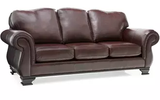 3933 - This sofa is large and in charge with its classic traditional styling.  Semi attached back with classic curve, large rounded arms with nail stud detailing and wood base with ornamental legs.