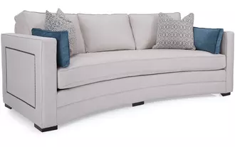 9015 - This beautiful curved sofa comes with loose back cushions and box bench seating.   Optional nail head decorative detailing on outside arm and curved back make this beauty a sight from all angles. Great for open concept areas where sofa can float central in the space.