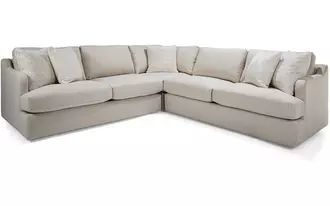 2529 - This sectional with its relaxed silhouette and deep seating is designed for laid-back living. Soft curves at the arms add a touch of fluidity, while oversized cushions create an inviting place to gather. A versatile style that combines casual comfort with modern simplicity.