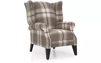 2220 - This traditional pushback wing chair is made for comfort. Lean back as simultaneously your foot rest rises so you can stretch out and enjoy this finely crafted Canadian recliner.