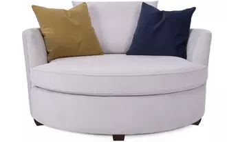 2992-59 - Round out your living room with the contemporary curves of this chair lounger. This inviting swivel chair beckons you to kick off your shoes and snuggle up. A tight barrel back completes the circle with a loose back pillow and several oversized throw pillows.