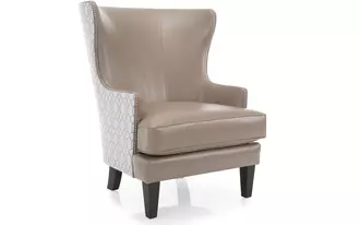 3492CLG - This chair is timeless and dramatic. Slight wing, slender inviting arm and exaggerated curved back.  Available with 2-tone fabric selection and optional nail studs to add to this chair’s dramatic flair.