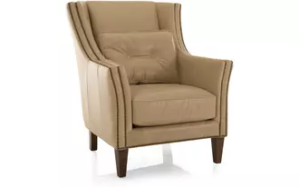 3825 - A chair built for comfort and style. Beautifully detailed with double row nail studs applied to the arm facing and along the bottom band of the chair.   Lumbar pillow with hand button tufting adds to the comfort of this chair. Easily fits into a traditional or transitional lifestyle.