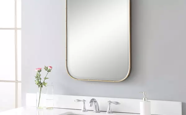 malay vanity mirror by uttermost